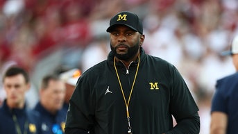 Fired Michigan coach spends night in jail as prosecutor weighs potential charges - Fox News